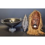 A carved Maori style wooden tribal mask; another with stand;