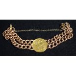 A 9ct gold curb link bracelet with an Edwardian gold sovereign 1906, 40.