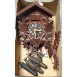 A novelty carved wooden Cookoo Clock,