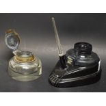 An Art Deco Bakelite desk inkstand and pen and a brass capped inkwell