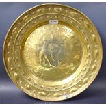 A Dutch brass circular alms dish,