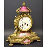 An early 20th century French porcelain mounted clock, striking on a gong, c.