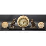 An Art Deco bronzed and marble clock garniture, the round marble clock with Roman numerals,