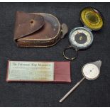 A leather cased Magnapole military compass;