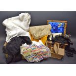 Textiles - a wicker sewing basket, a bone crochet hook, a white cotton dressing gown,