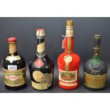 A bottle of Courvoisier; Drambuie; Cherry Marnier; Cointreau;
