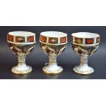 A Royal Crown Derby 1128 pattern goblet; two others,