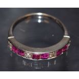 An Art Deco diamond and ruby half eternity ring,