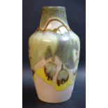 A Cobridge stoneware shouldered baluster vase, applied with large leaves and petals,