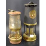 A 20th century miner's lamp; another similar,