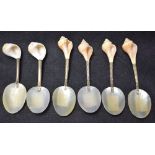 A set of six shell spoons, mother of pearl bowls, metal hafts,