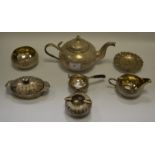 An Indian silver coloured three piece tea service, comprising of a teapot, milk jug,