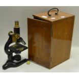 A Flatters & Garnett Ltd monocular Precision microscope, black brass body.