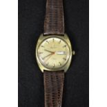 Bulova - a 1960's gentleman's day date wrist watch, brass coloured dial, two tone baton markers,