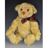 A modern Steiff millennium golden mohair hunchback Teddy bear, with growler, 42cm long,