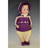 A German bisque headed doll, marked P.St.