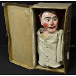 An early 20th century papier maché ventriloquist dummy, balding head, red hair,
