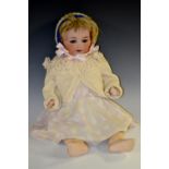 An Armand Marseille German 990 bisque head doll, sleeping blue eyes, open mouth, blond wig,