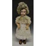 A Jumeau bisque head Tete doll, with fixed blue eyes, bisque head marked Depose Tete Jumeau Bte S.G.