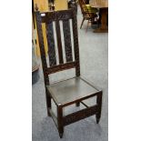 A late 19th century carved oak hall chair