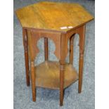 A Moorish style oak hexagonal occasional table, turned supports, undertier.