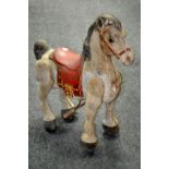 A Tri-ang Mobo Prairie King tin plate horse.