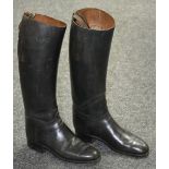 A pair of black leather riding boots, 42cm high,