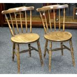 A pair of elm farmhouse kitchen chairs, spindle backs, circular seats,