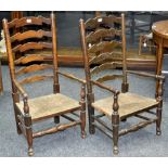 A pair of 19th century ladder back nursing chairs with rush seats, c.