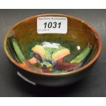 A Moorcroft bowl, tube lined in the Orchid pattern, flambe glaze, impressed marks,