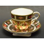 A Royal Crown Derby 1128 miniature cup and saucer