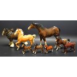 A Beswick large size gloss brown horse; a Beswick Palomino pony; a pair of Beswick brown foals;