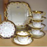 A Paragon China part tea service, gilded dark blue banding, pink roses, including eight side plates,