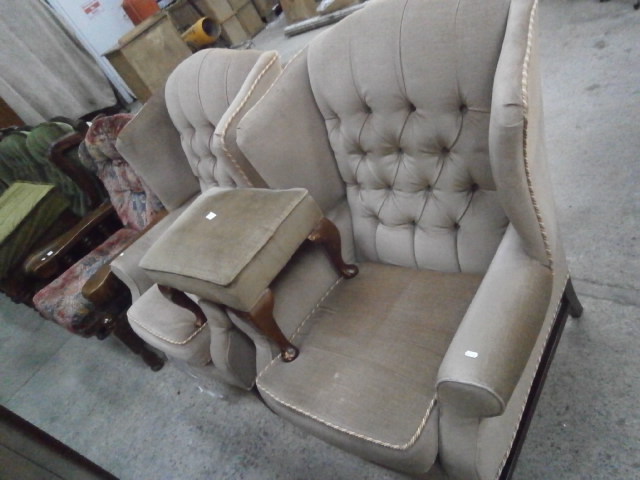 pair of upholstered wing back chairs and matching foot stool