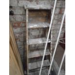 pair of wooden step ladders