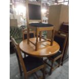 circular pine dining table and 4 chairs