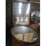 oval wood framed bevel edge mirror and 1 other