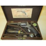 An Adams Revolver in a fitted case with accessories