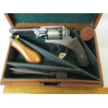 A Wedge Frame Webley Type Revolver in a case with accessories.