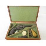 A 12mm Pin Fire Revolver in a fitted case with accessories.