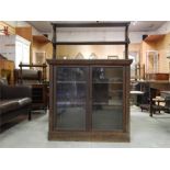 Glazed Bookcase Cabinet with upper tier on brass X frame supports early 19th century. ♢ ~