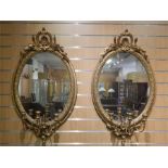 Pair Girandole Mirrors. 54cm wide, 96cm high. Some losses to mouldings. ~