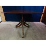 Twin Mahogany Pedestal dining table with one leaf, pedestals with brass capped castors, late 19th