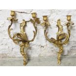 Pair of gilt metal candle sconces in Roccoco/late baroque style. 37-39cm in height, they are