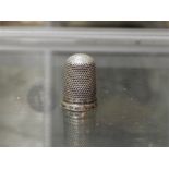 A silver thimble marked - Maker - Check C.H. Date letter:
