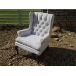 Wing armchair on cabriole front legs.