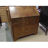 Oak bureau - 18th Century - on bracket feet, with two secret drawers, brass swan neck handles.