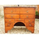 An 18th Century walnut bachelors chest on arched supports with folding top and two side drawers,