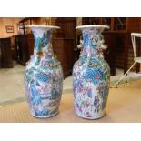 A Pair of Chinese late 19th Century / 20th Century Famille Rose floor Standing vases - losses and
