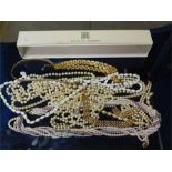 Simulated Pearl necklaces and gold colour costume jewellery in long cardboard box